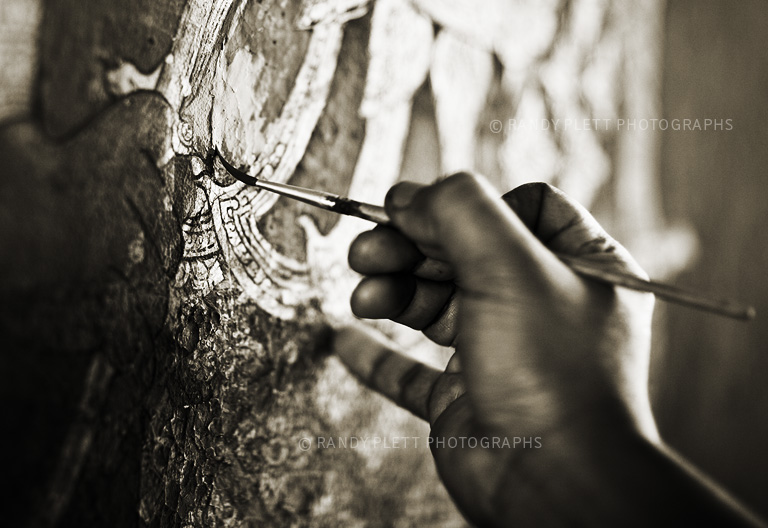 Buddhist Monk Painting in a Temple in Thailand